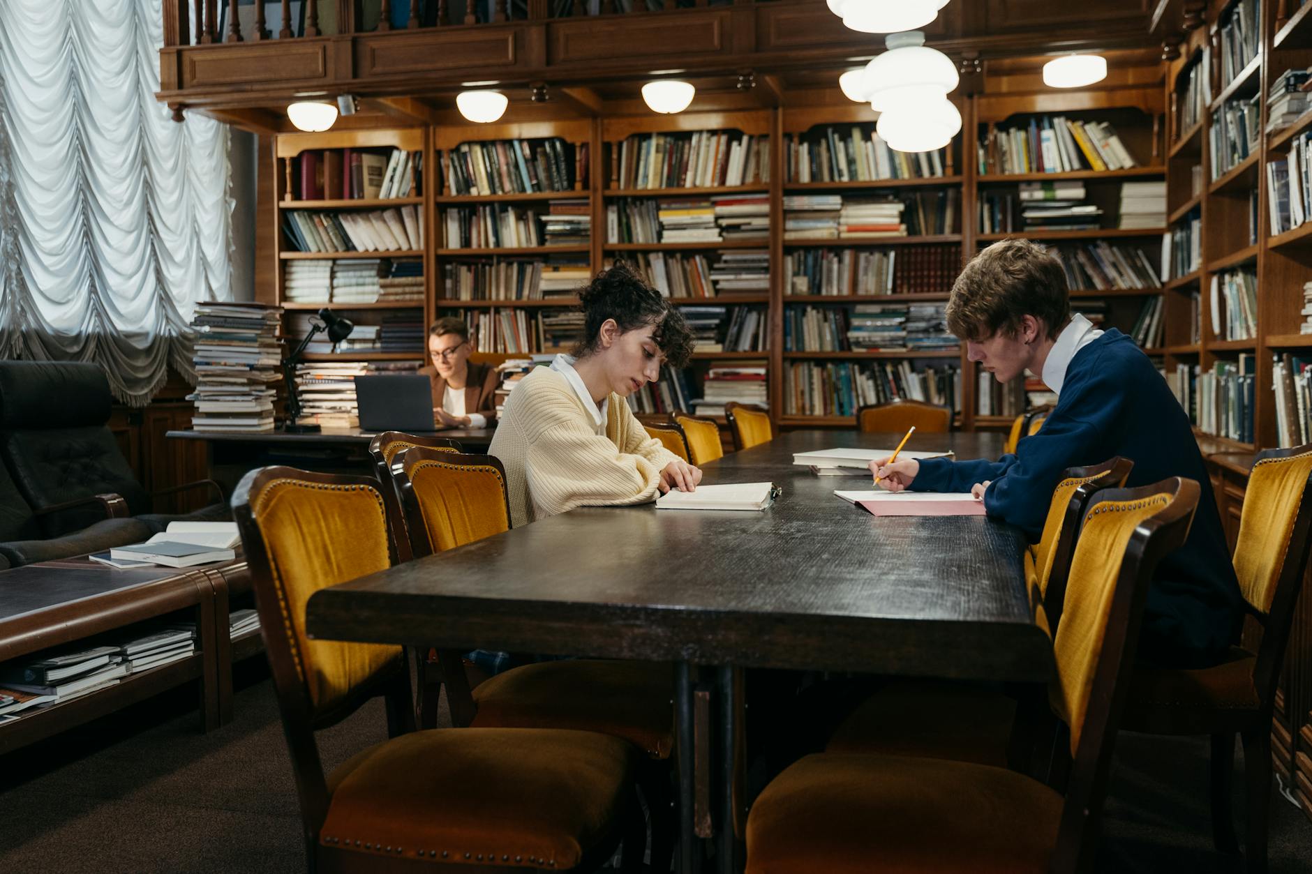 Students studying with books